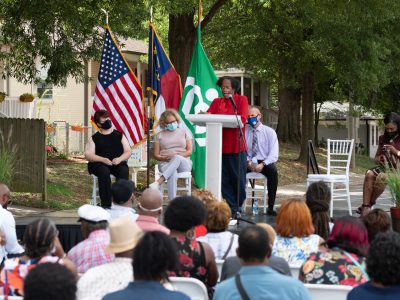 The Genesis Park Neighborhood Association invited Charlotte leaders and neighbors got together for the unveiling of a revolving art project of a neighborhood leader.